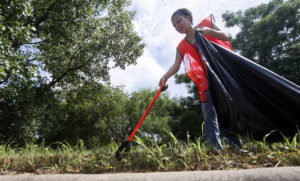 Ricardo B. Brazziell AMERICAN-STATESMAN 7/24/10 Volunteer Tammy Barnes and other members of the National Forum for the Black public Administrators (NFBPA) and the Austin code Compliance Department partnered up to clean the St. Johns community on Saturday, morning July 24, 2010.