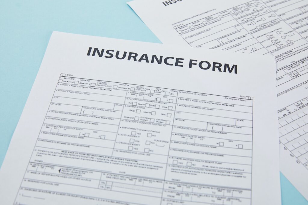 close-up view of insurance form on blue, insurance concept
